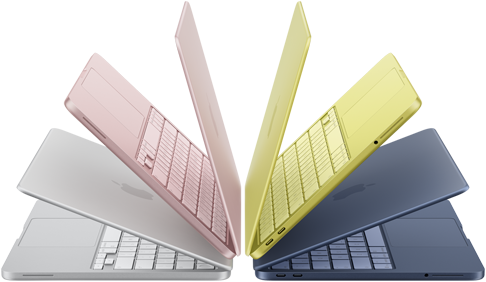MacBook Neo laptops in silver, blush, citrus, and indigo colors, slightly open and arranged in an arch formation